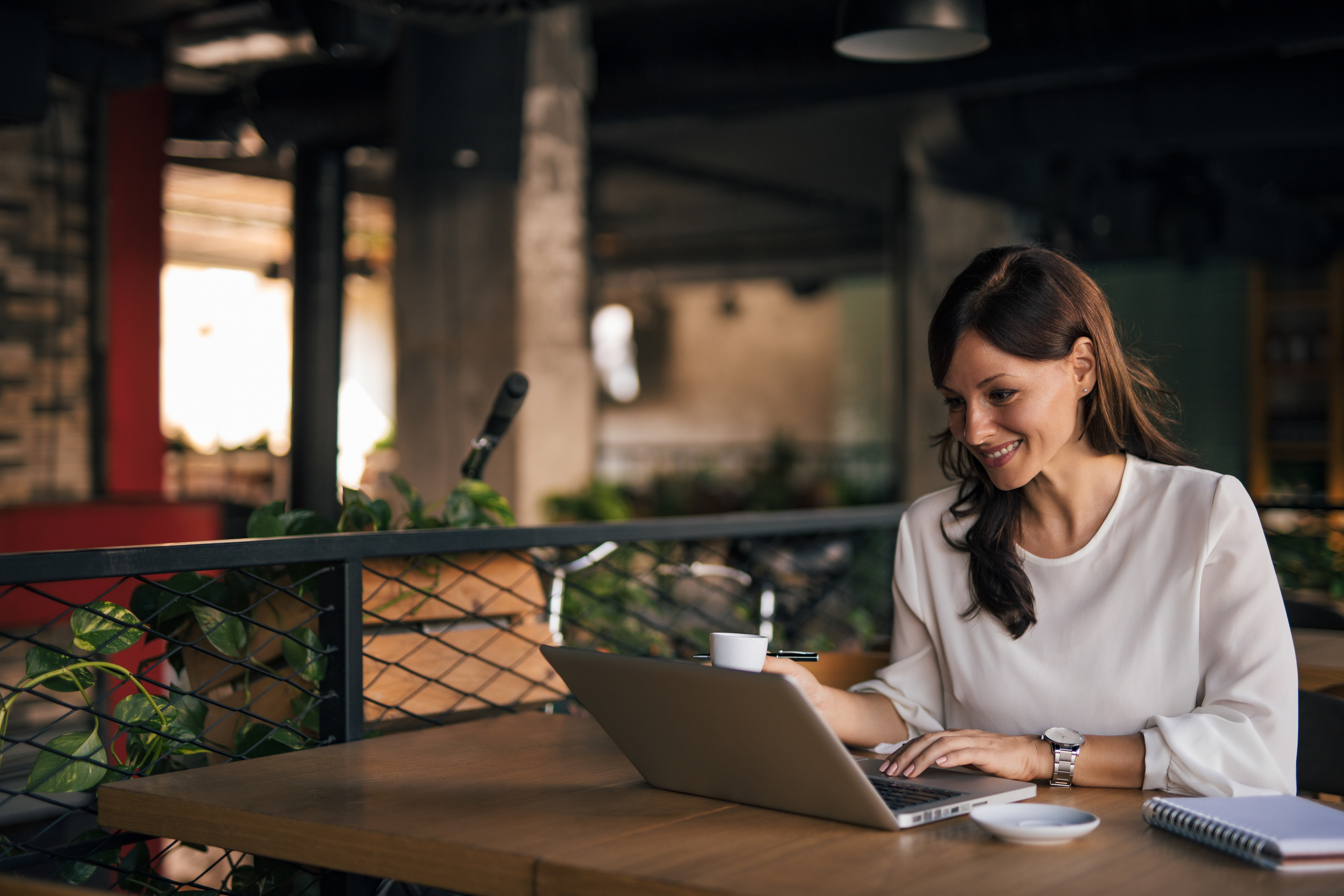 Woman using laptop, working.